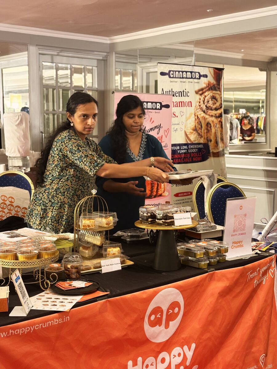 Vendors serving cinnamon rolls and bakes at their stall